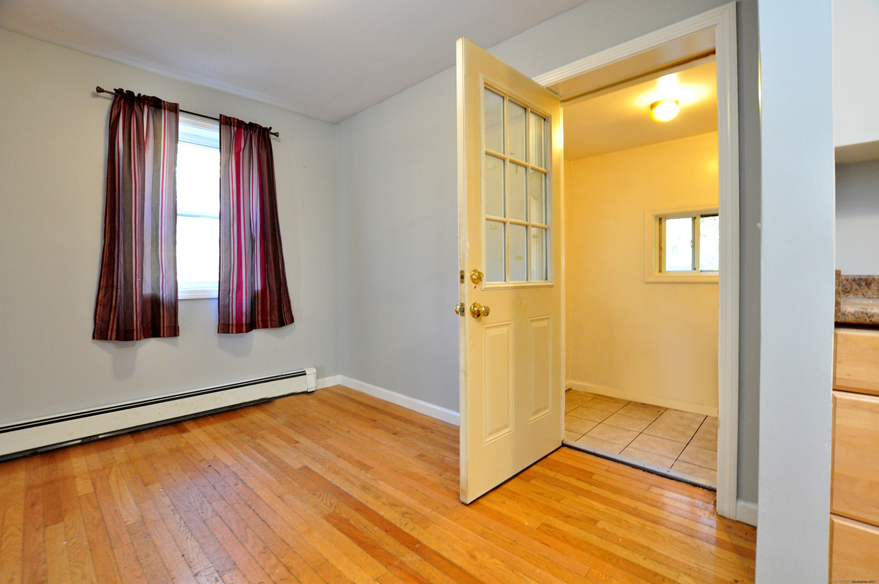 15 Clark Hill Road Prospect, CT 06712 - Photo 19 of 35 a view of a room with wooden floor and windows