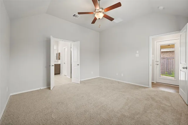 a bathroom with a bathtub a double vanity sink and mirror