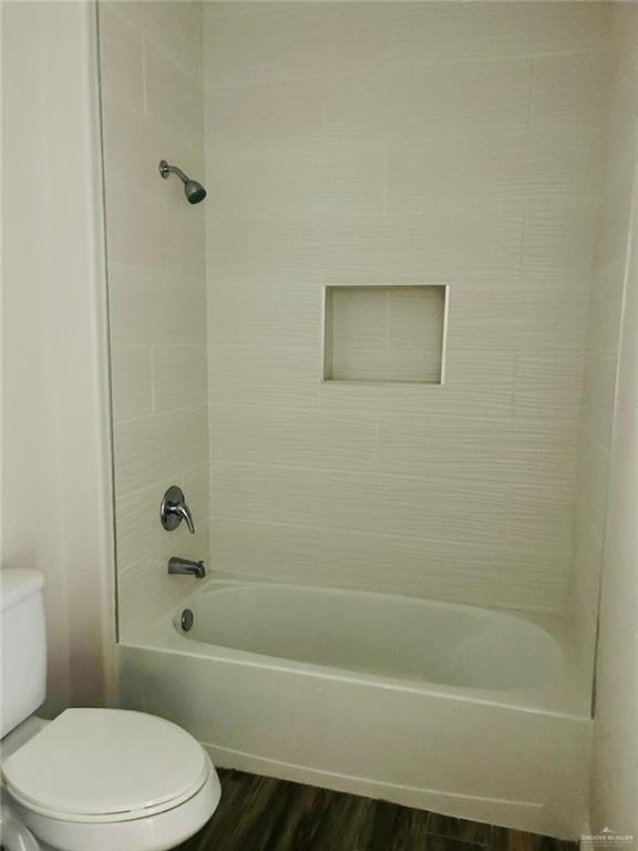 4904 North Crown Point, Unit 1 Pharr, TX 78577 - Photo 20 of 22 a bathroom with a toilet and a bath tub