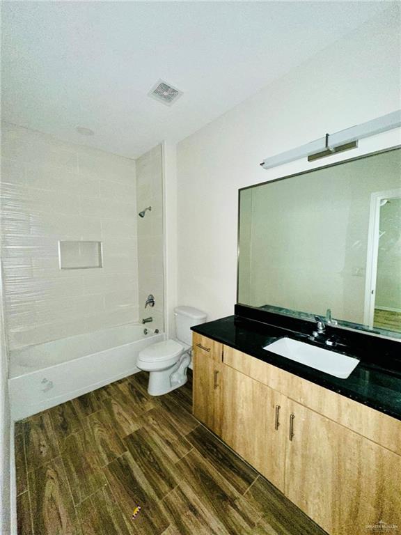 4904 North Crown Point, Unit 1 Pharr, TX 78577 - Photo 7 of 22 a bathroom with a granite countertop sink and a mirror