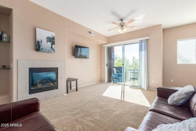 a living room with furniture and a window