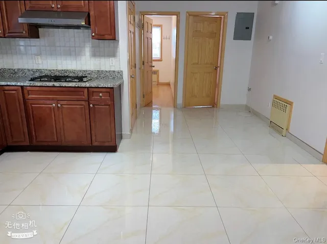 a kitchen with a cabinets and a stove top oven