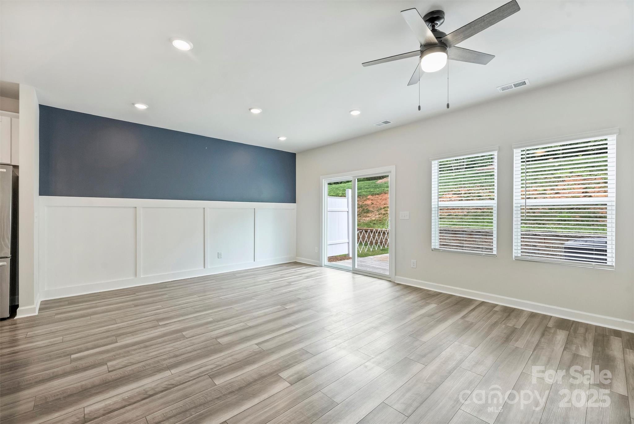 502 Tayberry Lane Fort Mill, SC 29715 - Photo 12 of 39 a view of an empty room with wooden floor and a window