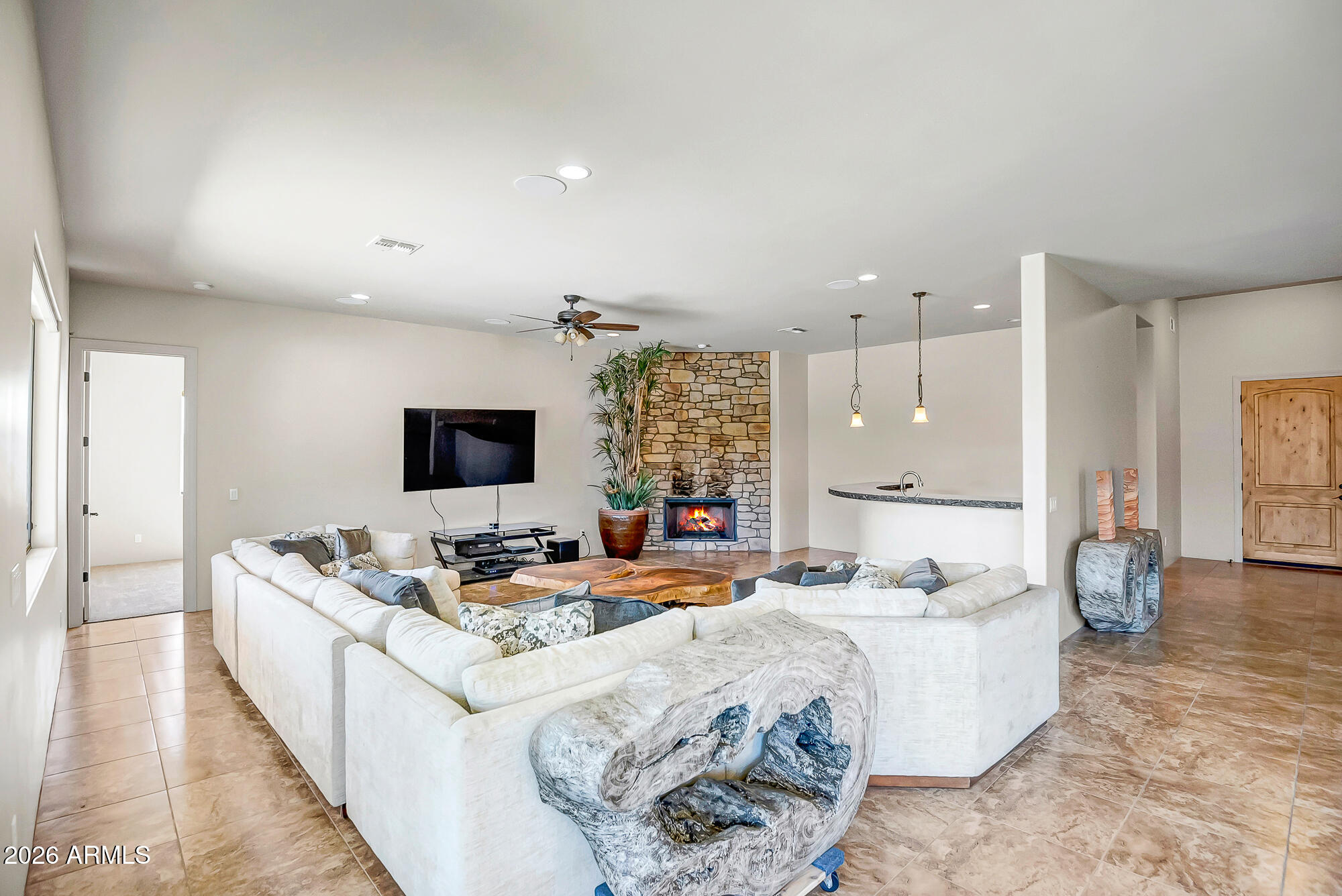 1121 East Saddle Mountain Road Phoenix, AZ 85086 - Photo 13 of 49 a living room with furniture and a flat screen tv