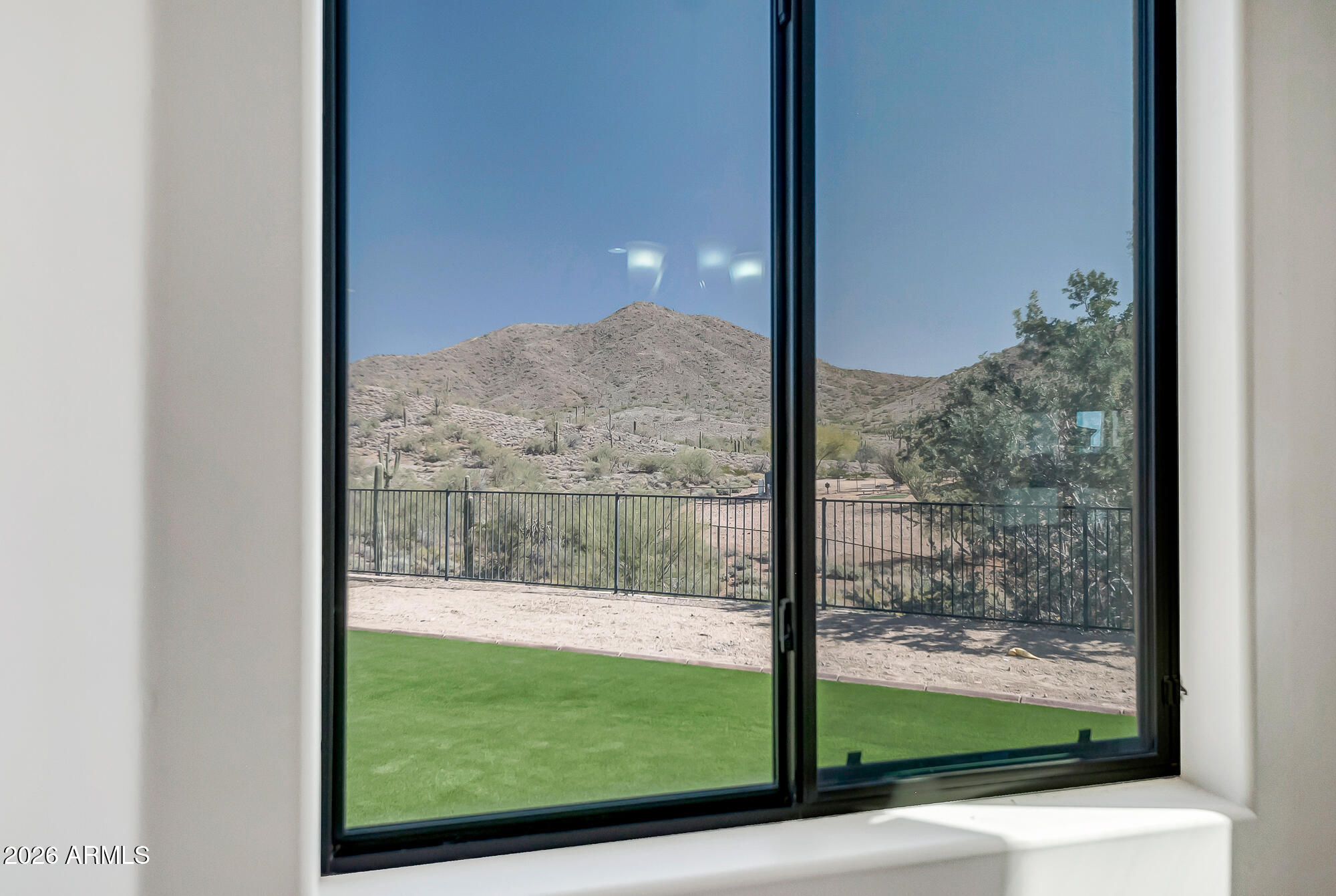 1121 East Saddle Mountain Road Phoenix, AZ 85086 - Photo 15 of 49 a view of a glass door with a yard