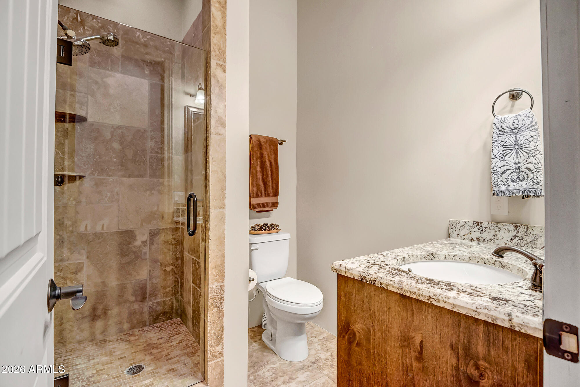 1121 East Saddle Mountain Road Phoenix, AZ 85086 - Photo 24 of 49 a bathroom with a granite countertop sink a toilet and shower
