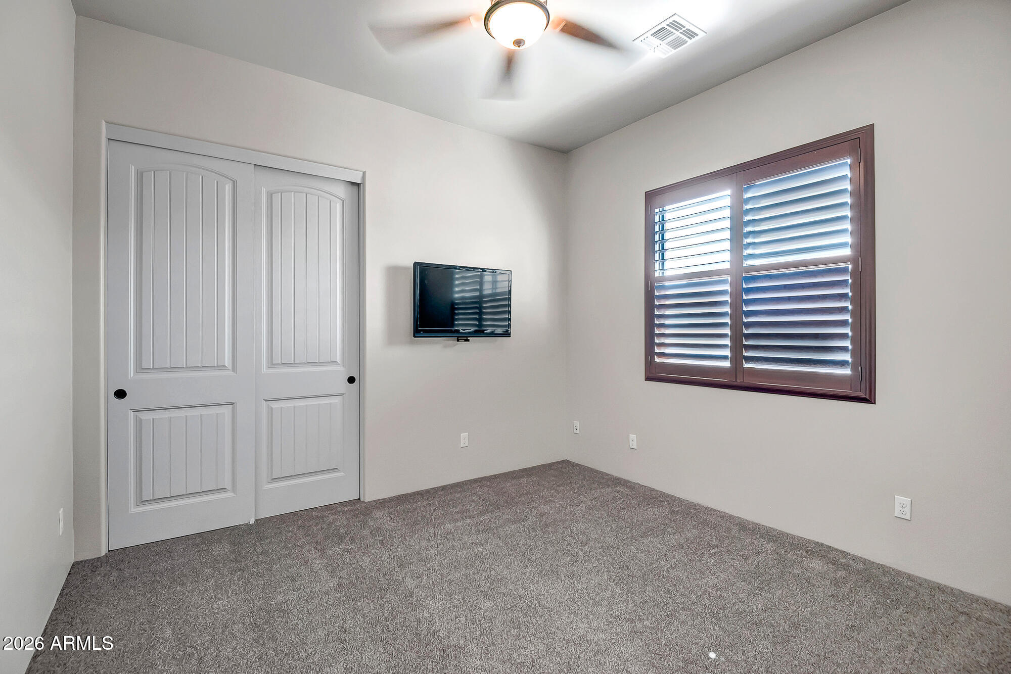 1121 East Saddle Mountain Road Phoenix, AZ 85086 - Photo 25 of 49 a view of livingroom with an empty space & a ceiling fan
