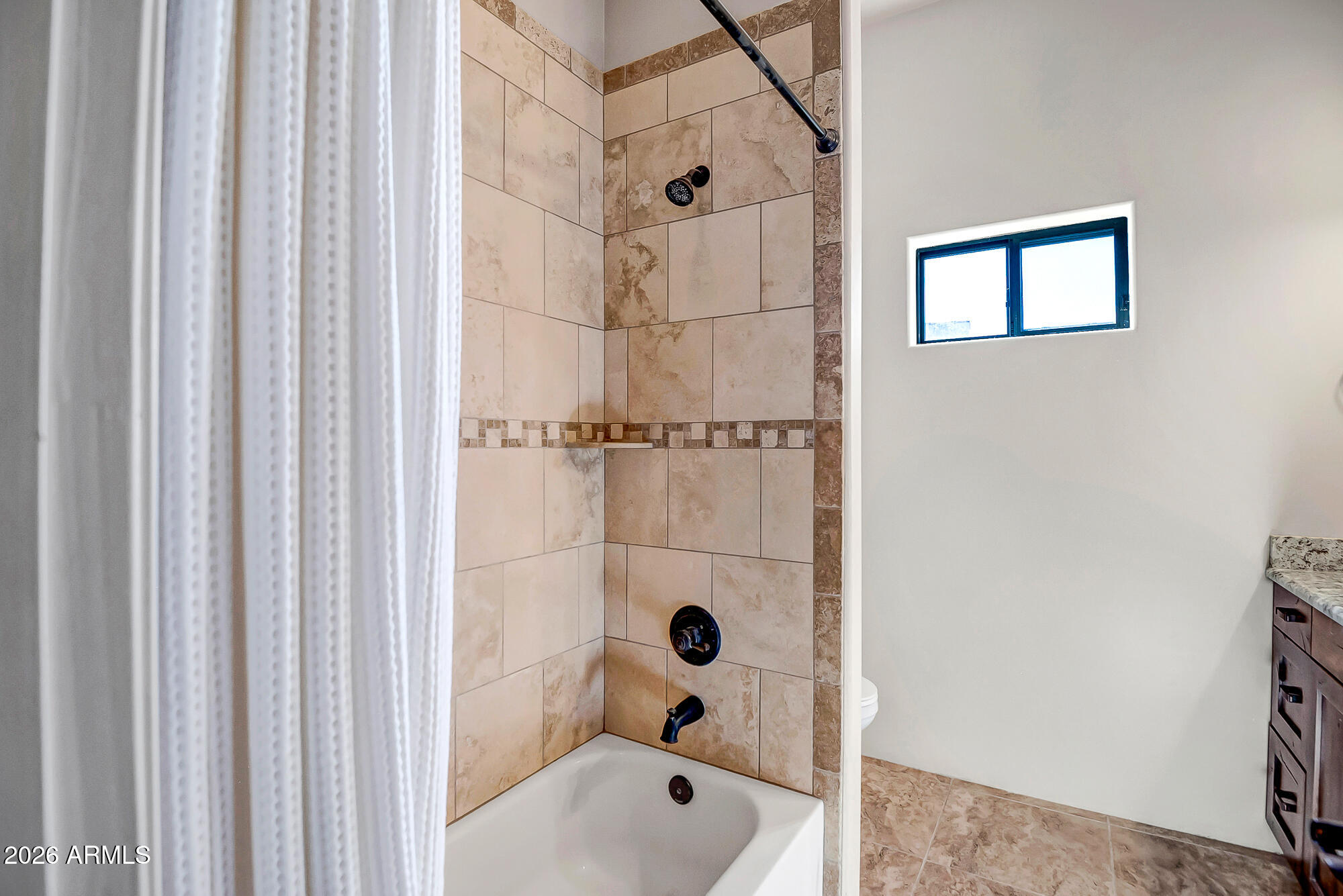1121 East Saddle Mountain Road Phoenix, AZ 85086 - Photo 30 of 49 a bathroom with a tub shower and sink