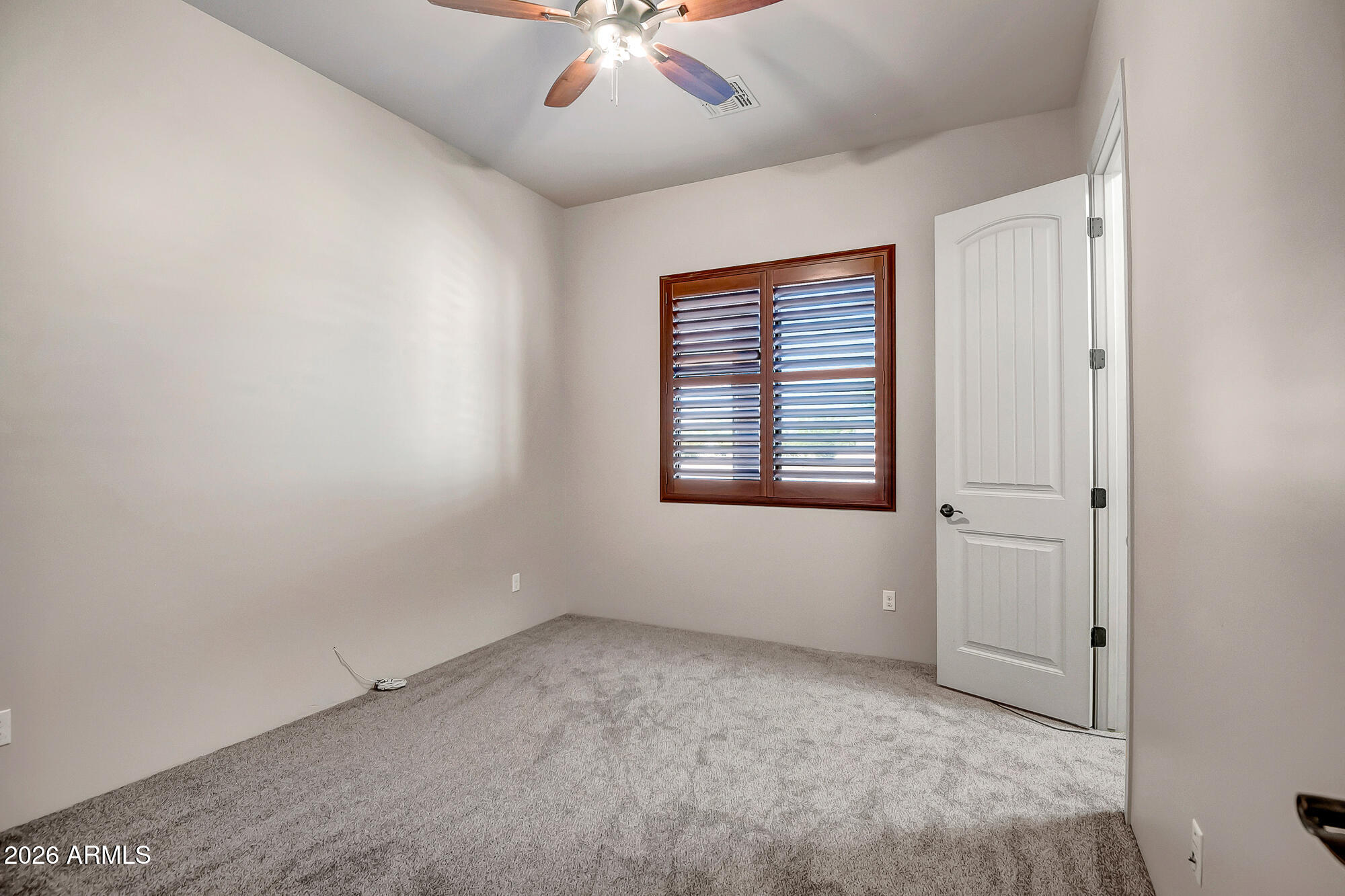 1121 East Saddle Mountain Road Phoenix, AZ 85086 - Photo 31 of 49 a view of an empty room with a window