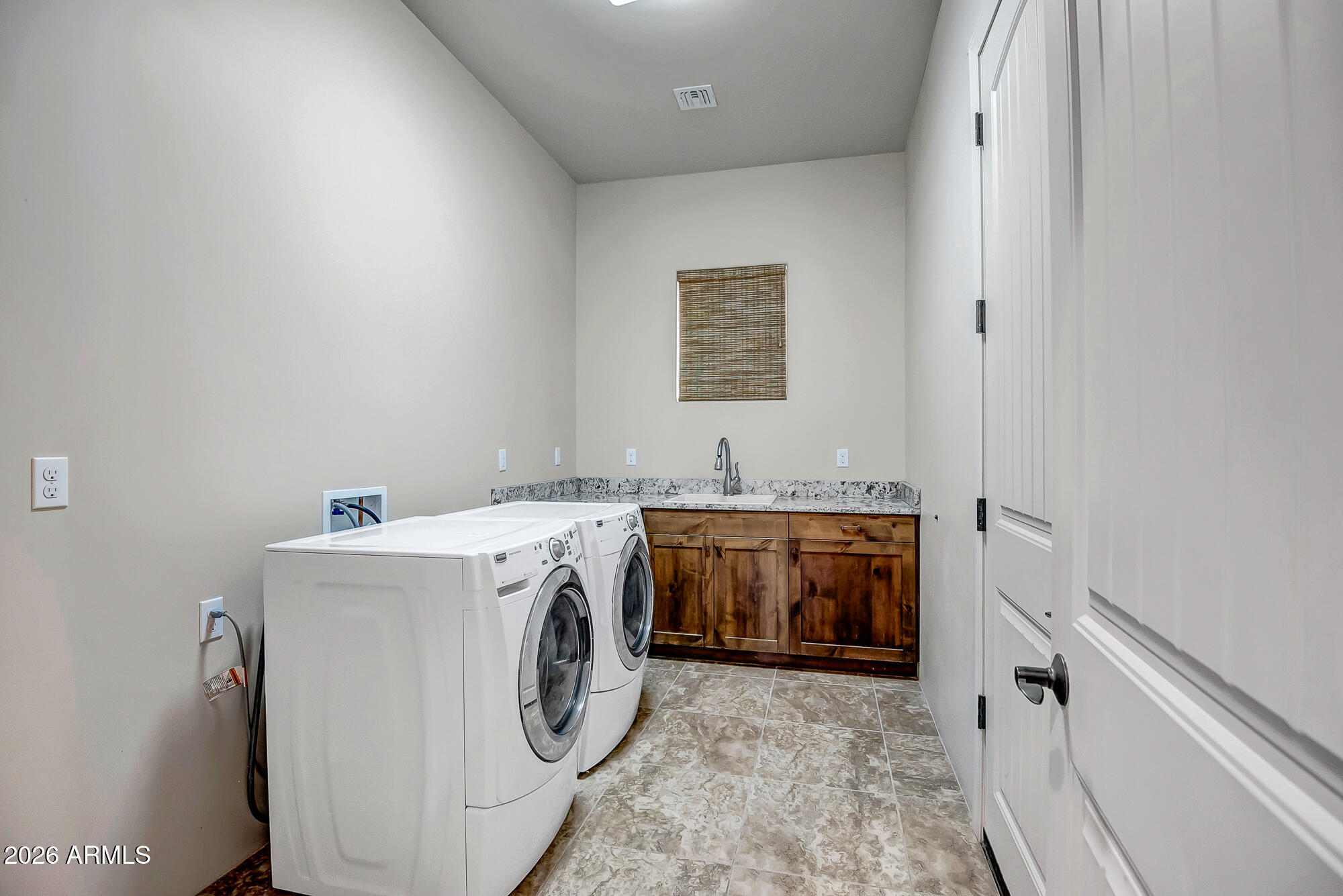 1121 East Saddle Mountain Road Phoenix, AZ 85086 - Photo 33 of 49 a utility room with dryer and washer