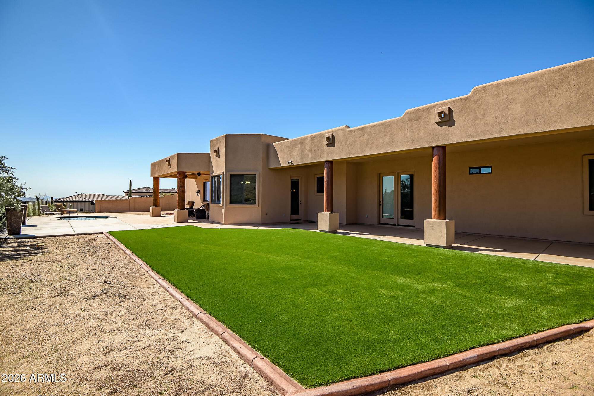 1121 East Saddle Mountain Road Phoenix, AZ 85086 - Photo 35 of 49 a view of a house with a backyard