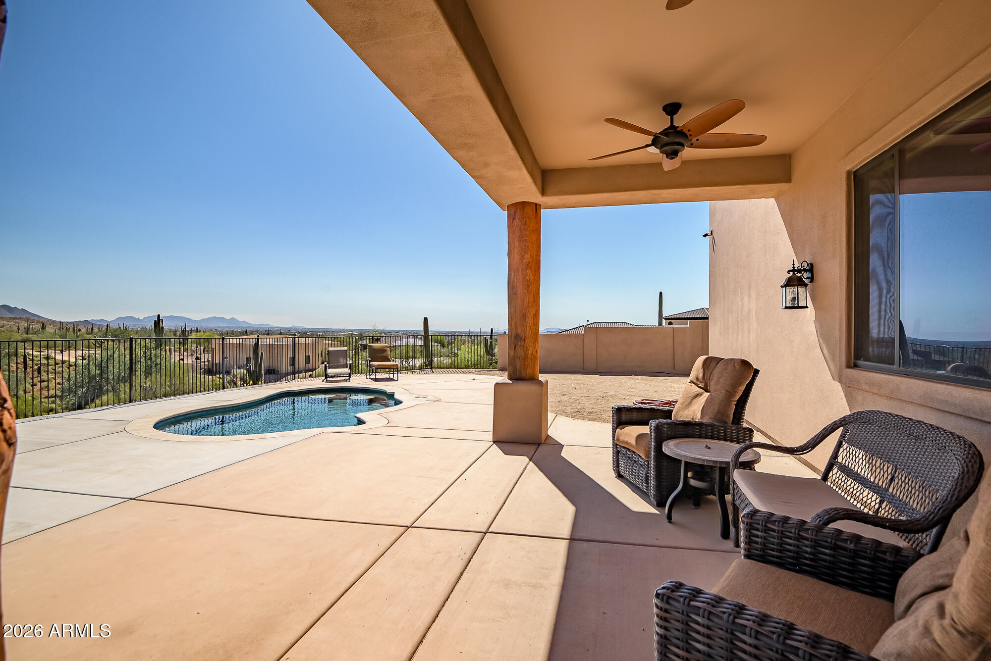 1121 East Saddle Mountain Road Phoenix, AZ 85086 - Photo 36 of 49 a view of a terrace with furniture and a potted plant