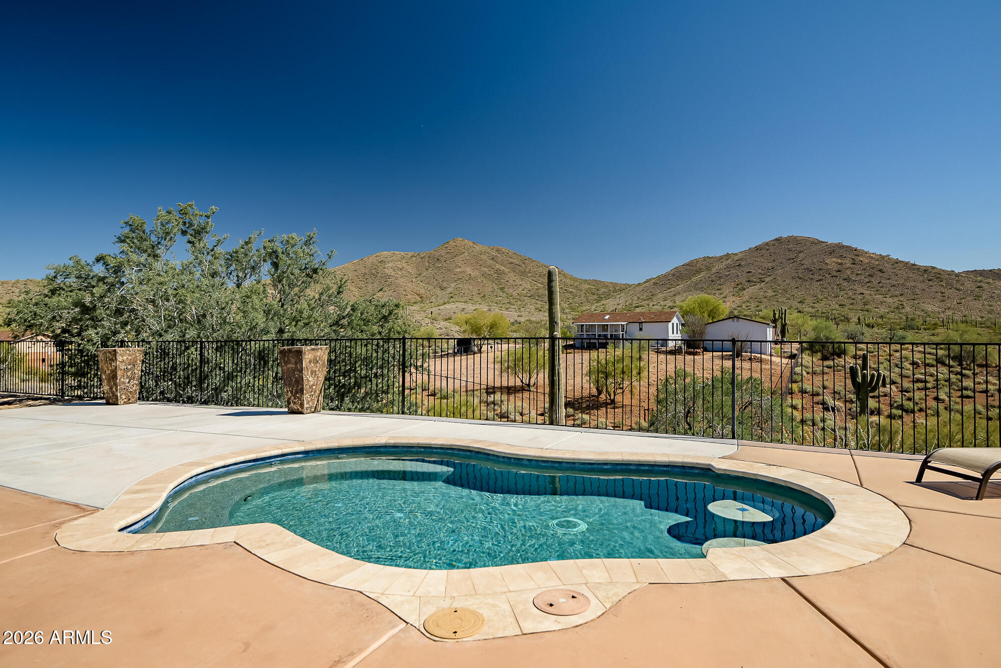 1121 East Saddle Mountain Road Phoenix, AZ 85086 - Photo 37 of 49 a view of a swimming pool with a lake view