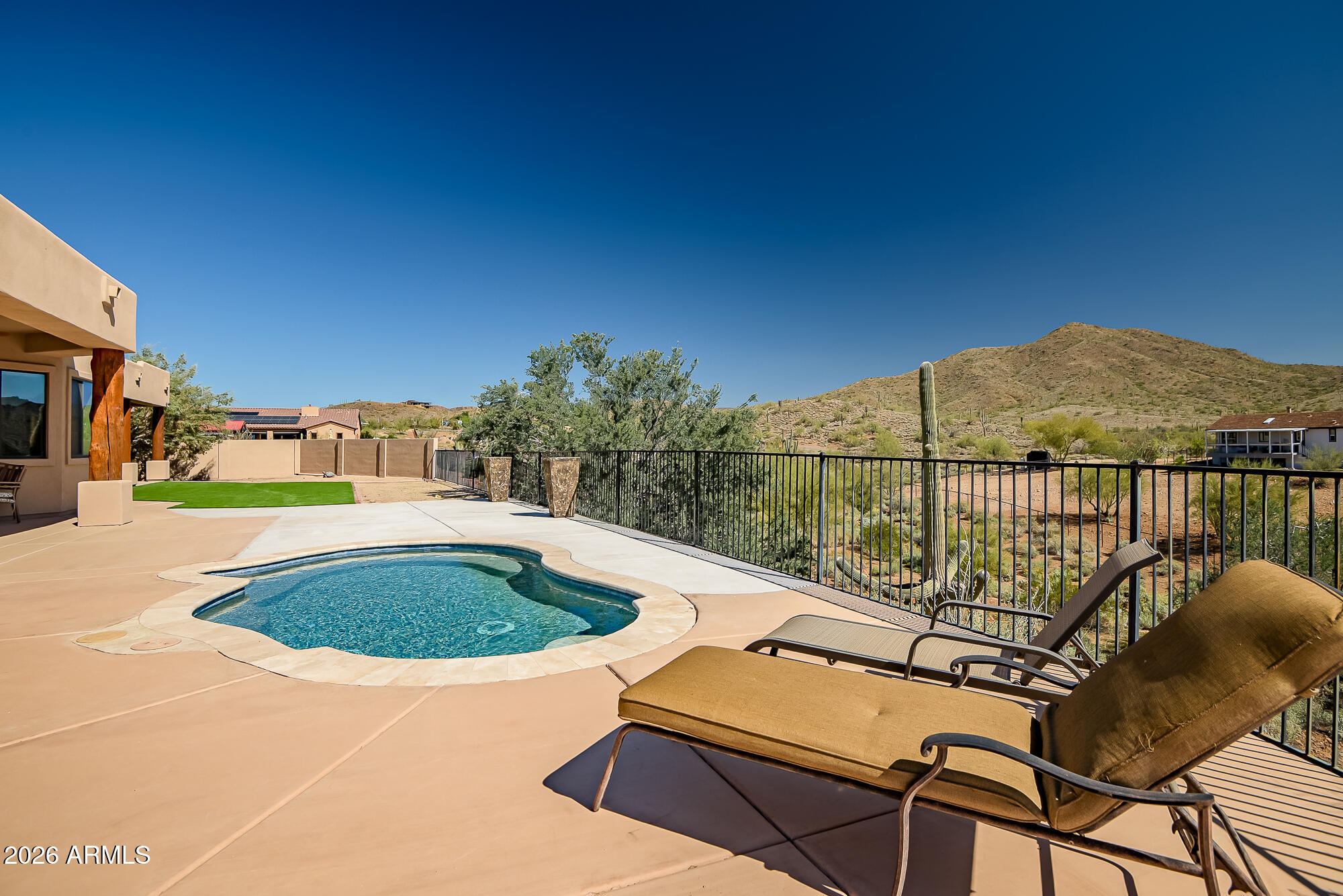 1121 East Saddle Mountain Road Phoenix, AZ 85086 - Photo 39 of 49 a view of a chairs and table in the terrace