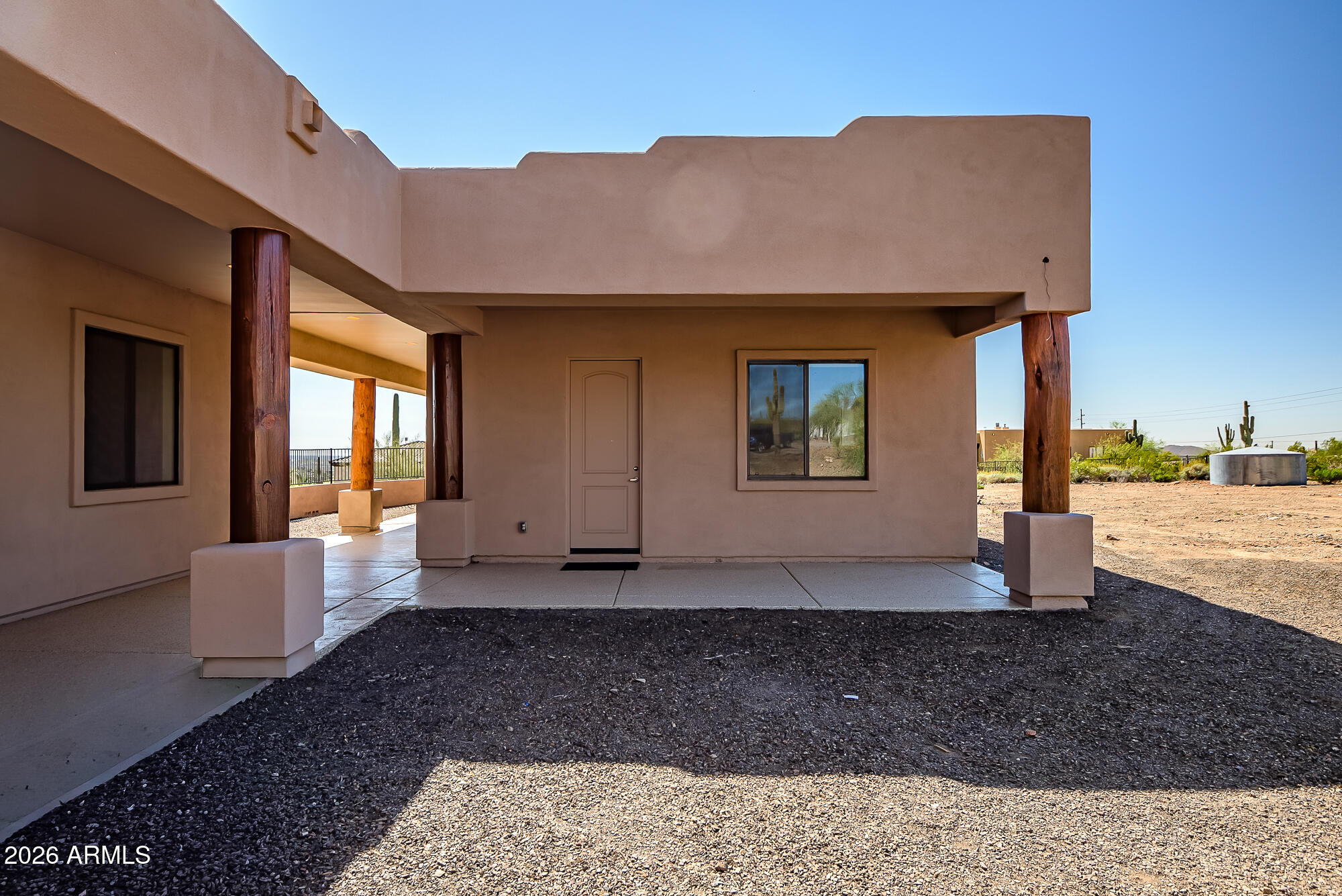 1121 East Saddle Mountain Road Phoenix, AZ 85086 - Photo 5 of 49 a view of a house with backyard and porch