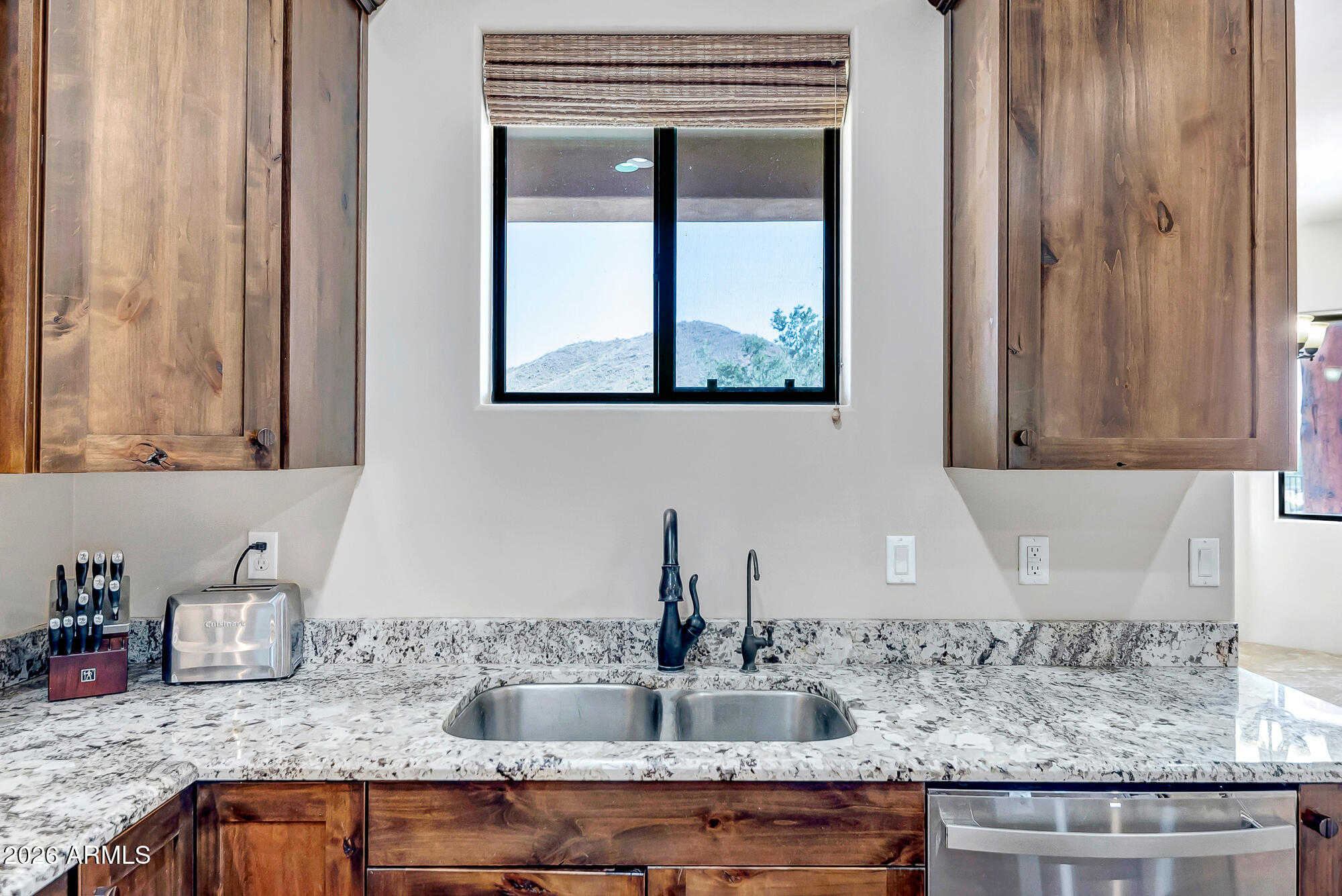 1121 East Saddle Mountain Road Phoenix, AZ 85086 - Photo 9 of 49 a kitchen with granite countertop a sink and a window