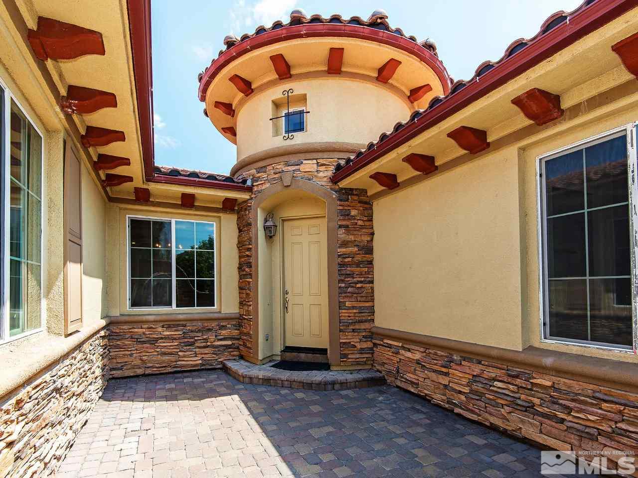 9980 Burghley Lane Reno, NV 89521 - Photo 2 of 24 a front view of a house with entryway