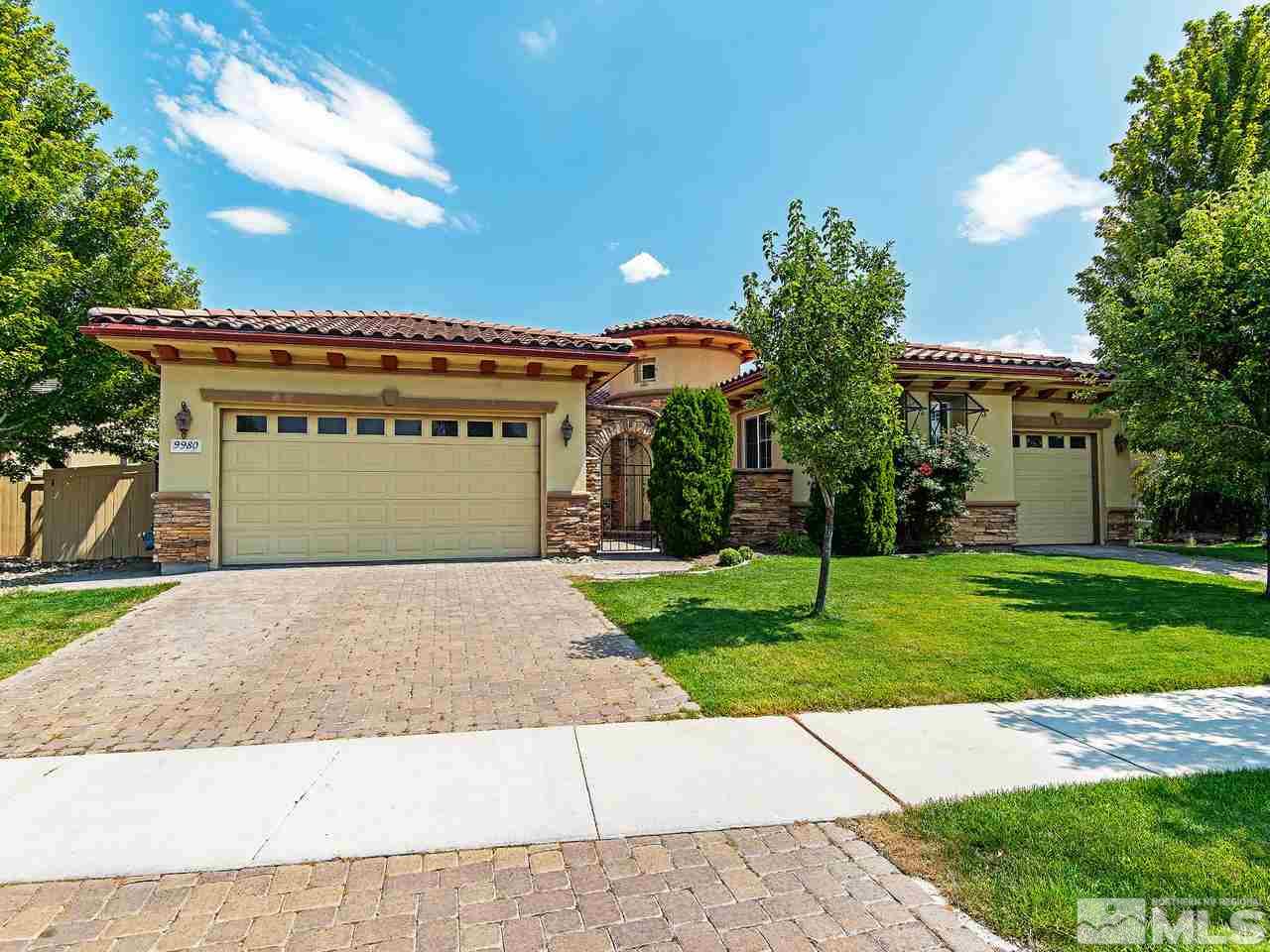 9980 Burghley Lane Reno, NV 89521 - Photo 24 of 24 a front view of a house with a yard and garage