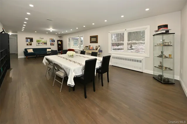 a large white kitchen with a table and chairs