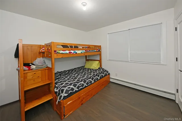 a bedroom with a bunk bed and a dresser