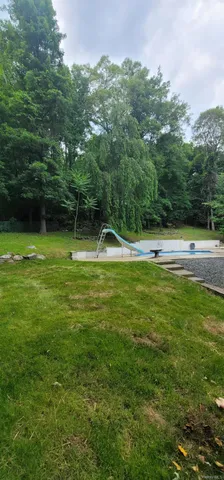 a view of outdoor space with deck and yard