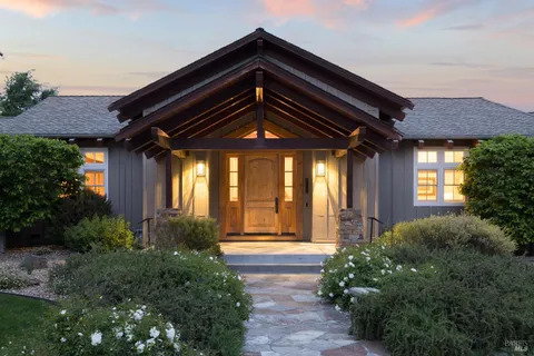 a front view of a house with garden