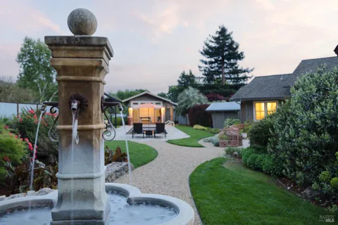 a front view of a house with garden