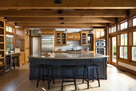 a dining table with chairs and wooden floor