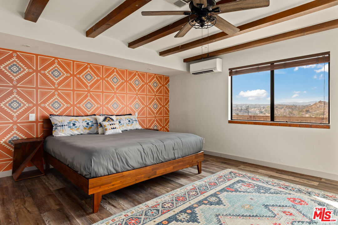 57387 San Juan Road Yucca Valley, CA 92284 - Photo 18 of 32 a bedroom with a bed and window