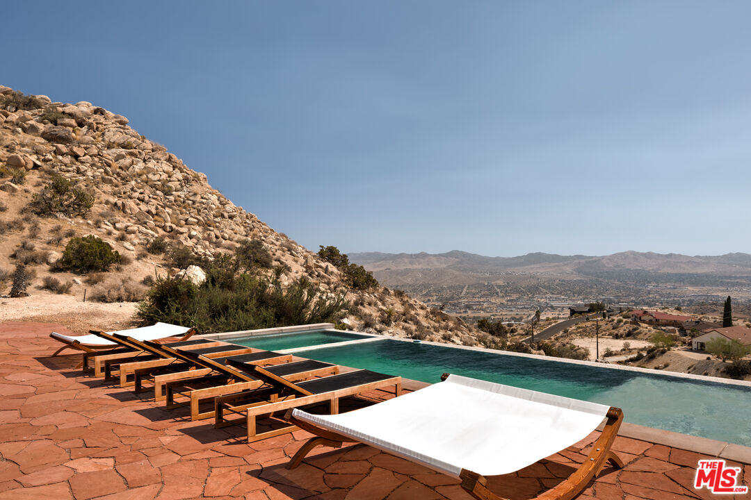 57387 San Juan Road Yucca Valley, CA 92284 - Photo 30 of 32 an outdoor space with lounge chair