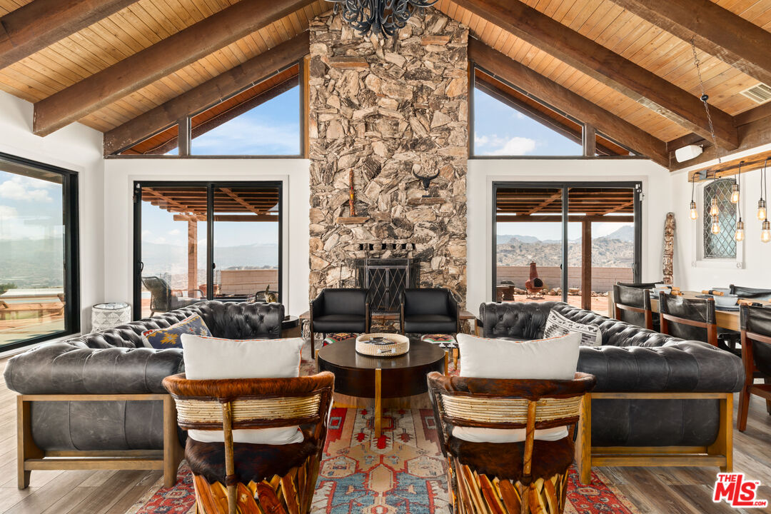 57387 San Juan Road Yucca Valley, CA 92284 - Photo 6 of 32 a living room with furniture and a large window