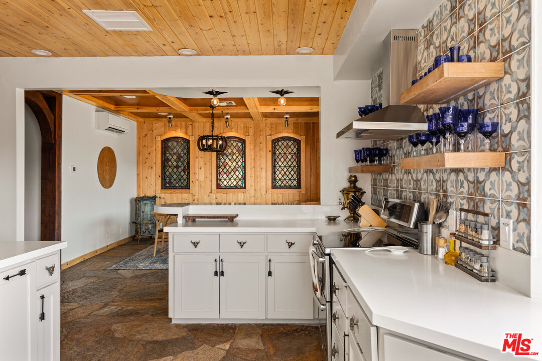 57387 San Juan Road Yucca Valley, CA 92284 - Photo 9 of 32 a view of a kitchen with utility room