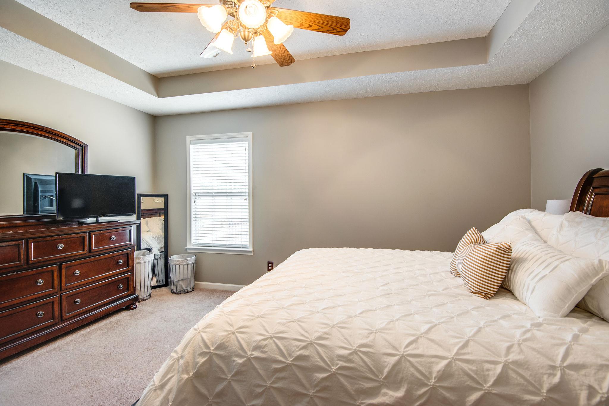 911 Franklin Road Charlotte, TN 37036 - Photo 16 of 30 Master Bedroom Features Tray Ceiling & Ceiling Fan