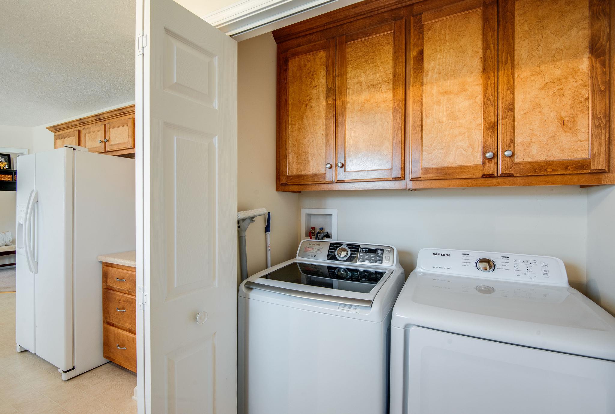 911 Franklin Road Charlotte, TN 37036 - Photo 19 of 30 Laundry Room w/ Custom Cabinets