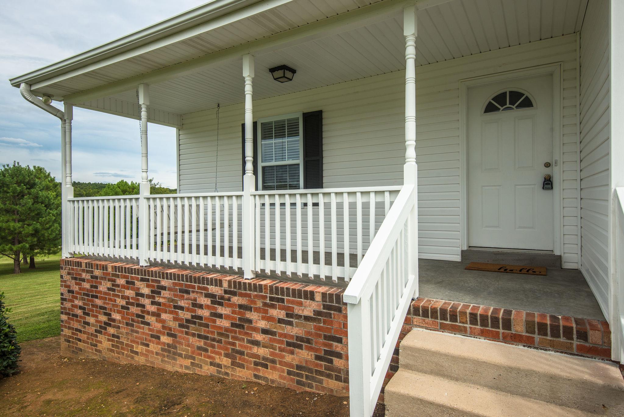 911 Franklin Road Charlotte, TN 37036 - Photo 22 of 30 Covered Front Porch w/ Concrete Walkway