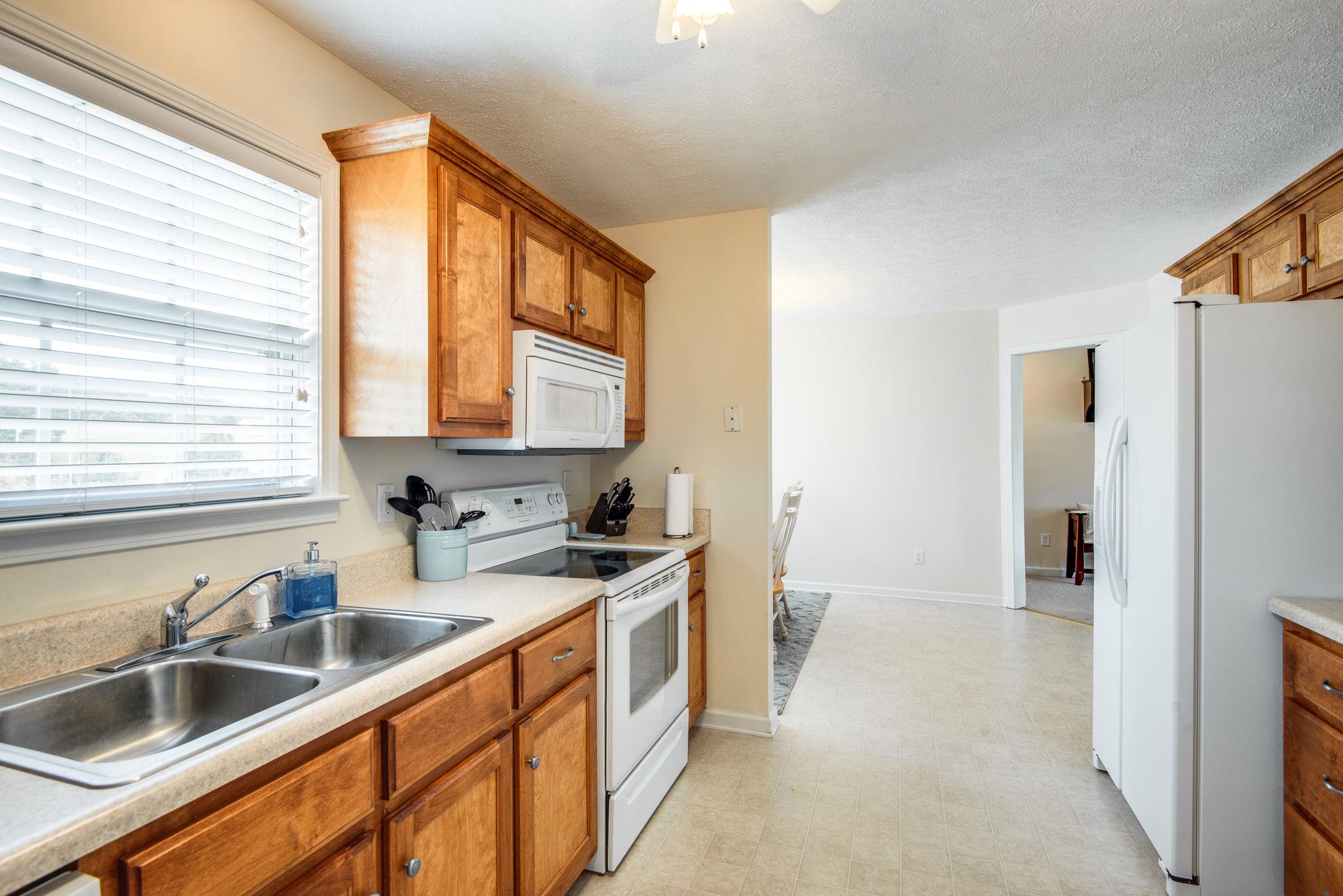 911 Franklin Road Charlotte, TN 37036 - Photo 6 of 30 Kitchen w/ Plenty of Cabinets Storage PLUS Pantry