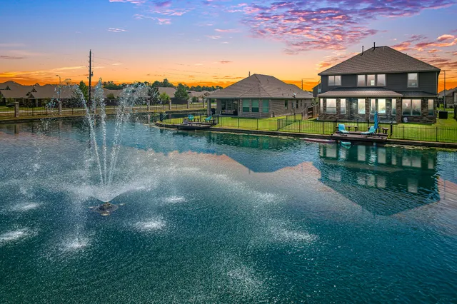 a view of a lake with a house in the background