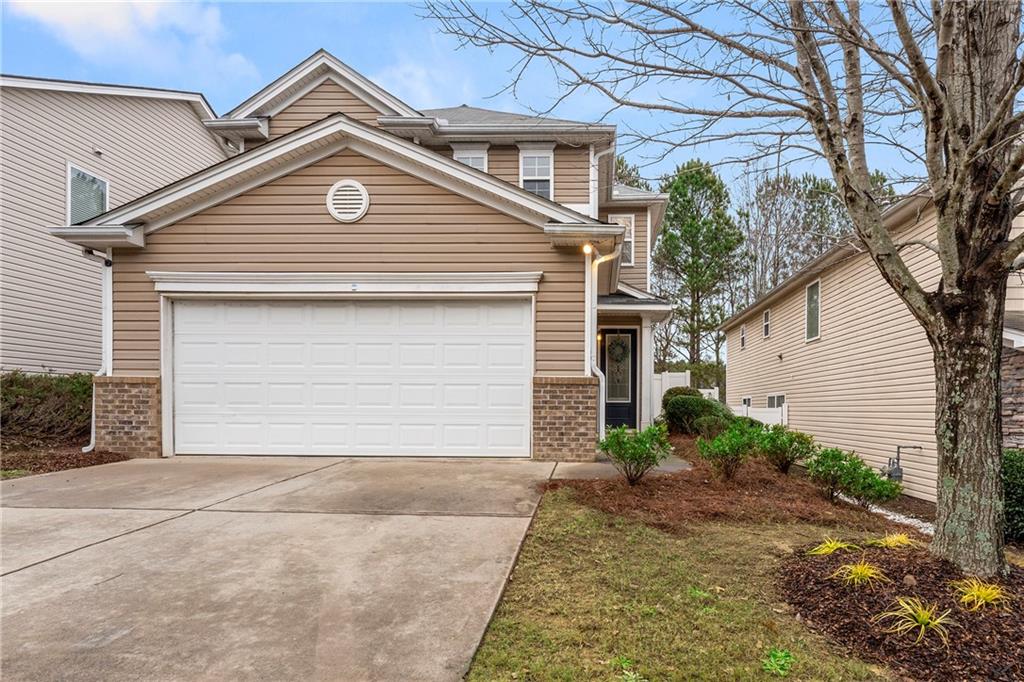 309 Silver Spring Street Dallas, GA 30157 - Photo 1 of 1 a small white house with a outdoor space