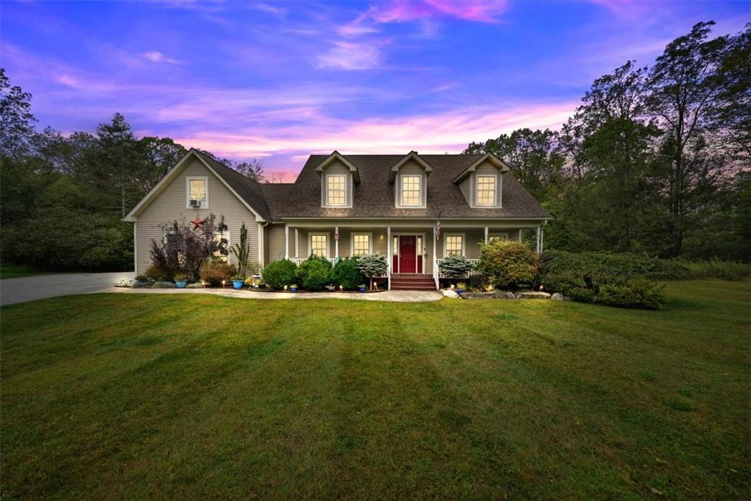 a front view of a house with a yard