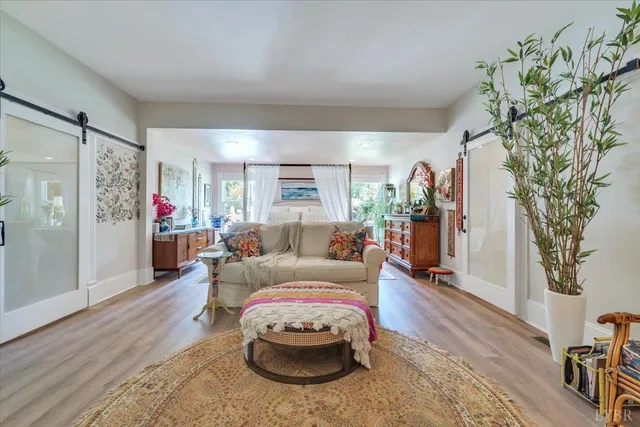 a view of a patio with table and chairs under an umbrella
