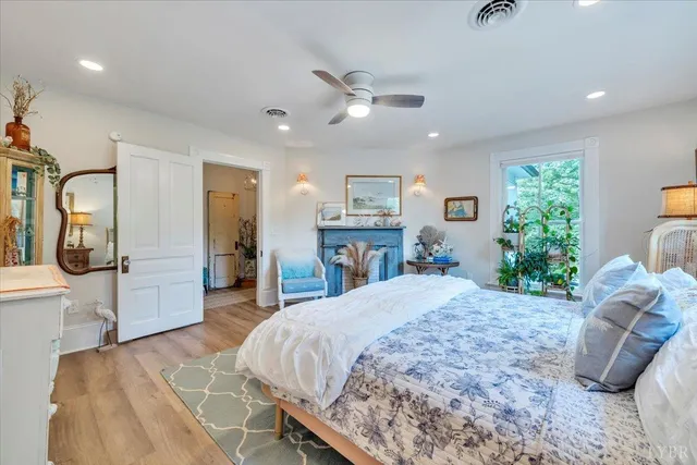 a view of a big house with a big yard and large trees
