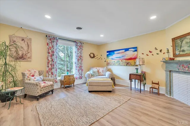 a living room with furniture window and wooden floor