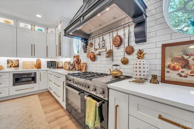 a view of a dining room with furniture wooden floor and chandelier