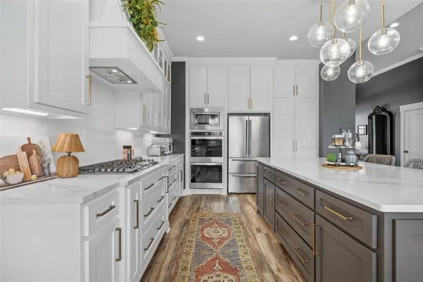 a kitchen with cabinets and window