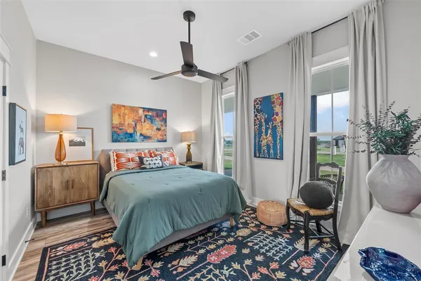 a bedroom with a bed and furniture