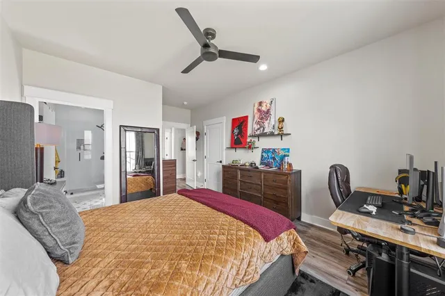 a bed room with a bed and a desk