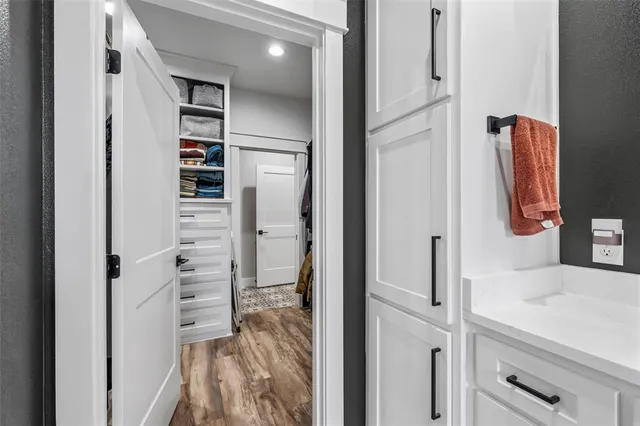 a bathroom with a shower and a sink