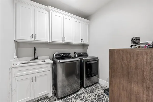 a view of storage and utility room with washer and dryer