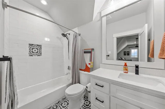 a bathroom with a sink toilet a mirror and shower