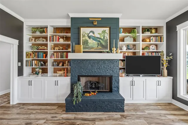 a living room with furniture and a fireplace